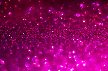 Defocused abstract background in magenta color. Glitter bokeh background. Decorative Christmas and New Year party background. Festive backdrop for your projects - obrazy, fototapety, plakaty