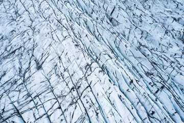 Fototapeten aerial view of glacier from above, ice texture landscape,Iceland © Lukasz Janyst