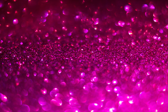 Defocused Abstract Background In Magenta Color. Glitter Bokeh Background. Decorative Christmas And New Year Party Background. Festive Backdrop For Your Projects