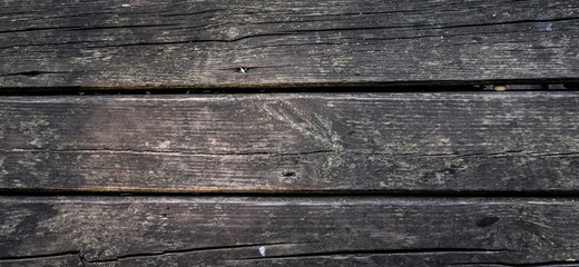 Wooden dark old dryly floor close up background texture
