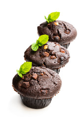 Triple chocolate muffins isolated on white