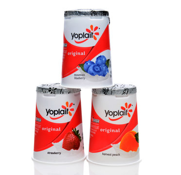 IRVINE, CA - SEPTEMBER 15, 2014: Three different containers of Yoplait Original Yogurt. In 1965, two French dairy co-operatives, Yola and Coplait, merged, becoming Yoplait.
