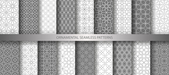 Big collection of light grey geometrical classic patterns. White, gray grille texture in Arabic, Oriental style. Set of seamless vector backgrounds.