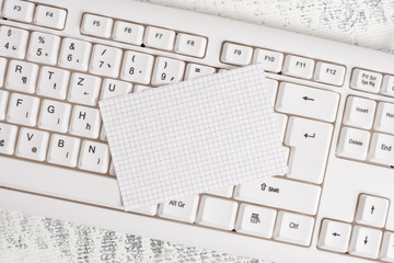 White keyboard office supplies empty rectangle shaped paper reminder wood