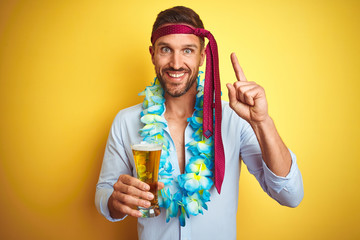 Hangover business man drunk and crazy for hangover wearing tie on head drinking beer surprised with an idea or question pointing finger with happy face, number one