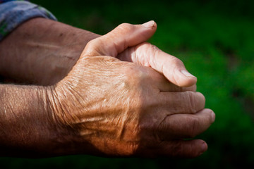 Fototapeta premium Grandmother prays for children and grandchildren