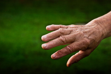 The old grandmother's hand on a light background