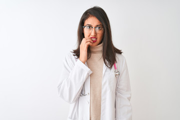 Chinese doctor woman wearing coat and pink stethoscope over isolated white background looking stressed and nervous with hands on mouth biting nails. Anxiety problem.