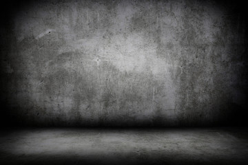 Grunge interior room with concrete wall and floor. Empty concrete space.