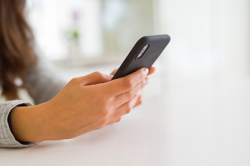 Close up of woman hands using smartphone