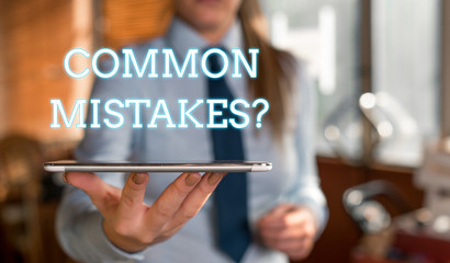 Word writing text Common Mistakes question. Business photo showcasing repeat act or judgement misguided or wrong Blurred woman in the background pointing with finger in empty space