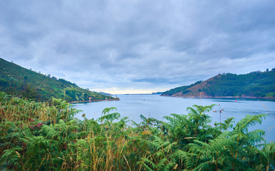 Galician coast landscape on a cloudy August day. Sea and mountain.