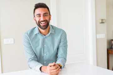 Fototapeta premium Handsome man smiling cheerful with a big smile on face showing teeth, positive and happy expression