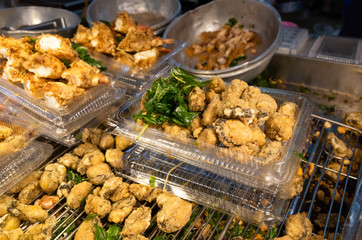 taiwanese fried chicken on a plate in the street