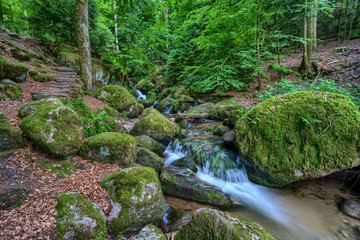 Obraz premium Wild romantic hiking trail along famous Gertelbach waterfalls, Black Forest, Germany