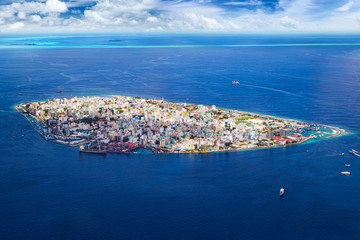 aerial view on male the capital city of maldives. overcrowded island in the indian ocean  blue...