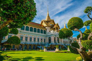 Emerald buddha temple golden pagoda blue sky with cloud sightseeing in Bangkok