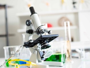 Microscopes and scientific test tubes in the laboratory.