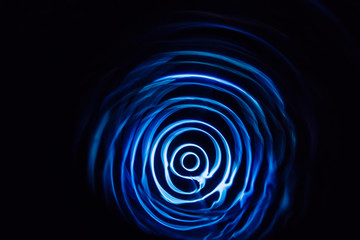 Sound waves in the dark. Blue color