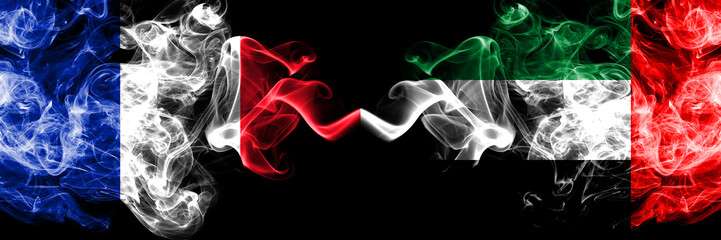 France vs United Arab Emirates, Emirati smoky mystic flags placed side by side. Thick colored silky abstract smoke banner of French and United Arab Emirates, Emirati