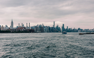 View on Manhattan midtown from Domino Park in Williamsburg, Brooklyn