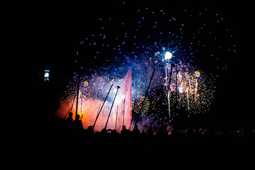 Colorful Fireworks with the Jet D'eau (water fountain) in Geneva Switzerland.