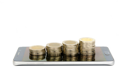 High and low coins on the smartphone screen on a white background Ideas for investing in online markets
