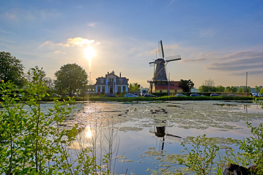 Historic windmills located in Kralingen Lake in Rotterdam, the Netherlands. © Jbyard