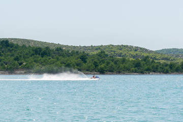 Obraz premium Young Man on Jet Ski, Tropical Ocean, Vacation Concept