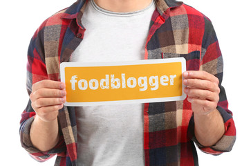 Man holding paper with text FOOD BLOGGER on white background