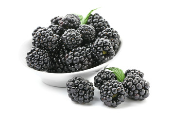 Bowl with ripe blackberry on white background