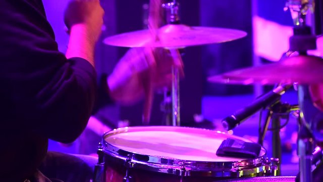 Drummer playing drums during an architectural college fest in Kerala.
