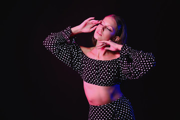 Fashionable young woman on dark background