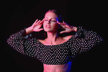 Fashionable young woman on dark background