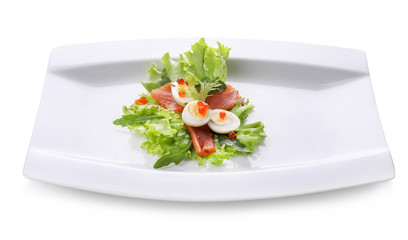 Plate of tasty fresh salad with quail eggs on white background