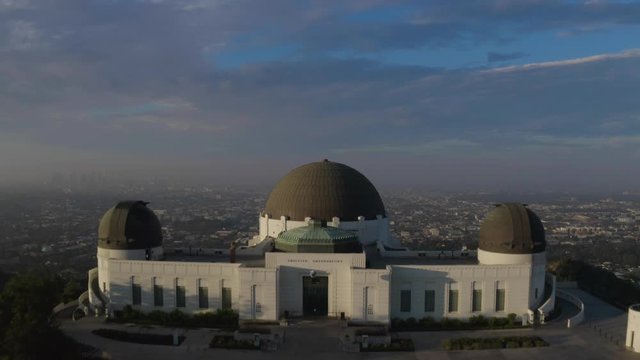 Aerial fly over Griffith Observatory during sunrise