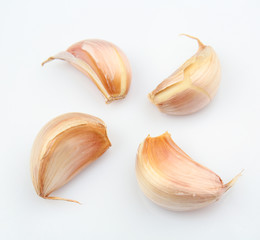 Fresh garlic cloves on white background