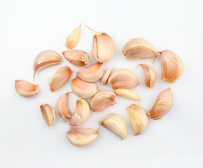 Fresh garlic cloves on white background