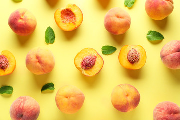 Many ripe peaches on color background