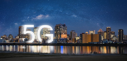 5G wireless internet technology in the city, Osaka city at night in Japan