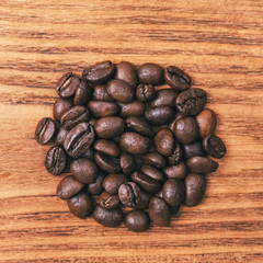 A cup of coffee and scattered coffee beans. Layout. Flat lay. Coffee bean.