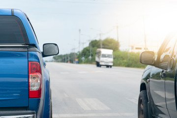 Obraz na płótnie Canvas Brake of blue pick up car on asphalt roads for travel or business work.