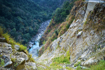 Canyon of mountain river on steep slopes, misty canyon, flashy river. Foothills Of Himalayas. Bhutan.