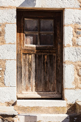 Old wooden door with window