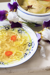 Traditional broth (chicken soup) with noodles.