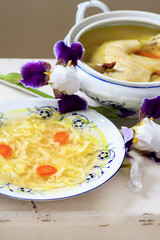 Traditional broth (chicken soup) with noodles.