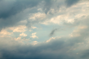 Dramatic picturesque colorful skies with cloud and picturesque sunbeams before sunset