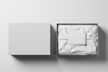 Open and closed white realistic cardboard box with brown paper and a business card on a light background. Business gift concept. Mock up. Top view. 3d rendering