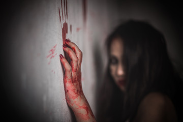 Bloody hands protruding from the wall, with the ghost girl as the background. Nightmares of scary...