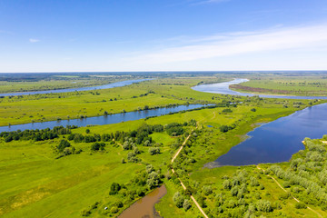 Big river and flood meadows. Aerial drone view